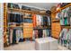 Walk-in closet featuring custom wooden shelves, drawers, and ample storage space for clothing and accessories at 3029 Quinebaug Rd, Fort Mill, SC 29715