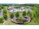 Aerial view of the community pool with water features and playground in a scenic neighborhood at 3029 Quinebaug Rd, Fort Mill, SC 29715