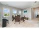 Cozy dining area features a glass table, seating for four, and lots of natural light at 3029 Quinebaug Rd, Fort Mill, SC 29715