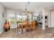 Inviting dining room with hardwood floors and an outdoor view; connected to the living area at 3029 Quinebaug Rd, Fort Mill, SC 29715