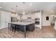Bright kitchen features a large center island, stainless steel appliances, and hardwood flooring at 3029 Quinebaug Rd, Fort Mill, SC 29715