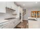 Bright kitchen features stainless steel appliances, including a gas cooktop, and white cabinetry at 3029 Quinebaug Rd, Fort Mill, SC 29715