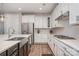 Spacious kitchen with stainless steel appliances, gas cooktop, stone countertops, and ample cabinet space at 3029 Quinebaug Rd, Fort Mill, SC 29715