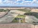 Aerial view of a house on a large property with farmland at 4815 Sugar And Wine Rd, Monroe, NC 28110