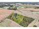 Aerial view of a house with a pond and farmland at 4815 Sugar And Wine Rd, Monroe, NC 28110