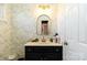 Updated bathroom with stylish navy vanity at 4815 Sugar And Wine Rd, Monroe, NC 28110