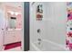 Bathroom with a shower/tub combo, pink walls, and a white vanity at 4815 Sugar And Wine Rd, Monroe, NC 28110