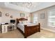 Bright bedroom with wood-framed bed, a rustic desk, and a wood-paneled ceiling at 4815 Sugar And Wine Rd, Monroe, NC 28110