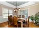 Formal dining room with wooden table, chairs, and a unique ceiling at 4815 Sugar And Wine Rd, Monroe, NC 28110