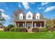 Brick home with dormer windows and a covered porch at 4815 Sugar And Wine Rd, Monroe, NC 28110