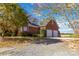 Two-car brick garage with gravel driveway at 4815 Sugar And Wine Rd, Monroe, NC 28110