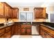 Spacious kitchen with dark wood cabinets, granite countertops, and stainless steel appliances at 4815 Sugar And Wine Rd, Monroe, NC 28110