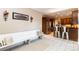 Eat-in kitchen area with white bench seating and metal bar stools at 4815 Sugar And Wine Rd, Monroe, NC 28110