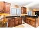 Kitchen with dark wood cabinets, granite countertops, and stainless steel appliances at 4815 Sugar And Wine Rd, Monroe, NC 28110