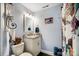 Cozy bathroom featuring a white vanity with a marble countertop and a shower curtain at 9542 Riviera Dr, Sherrills Ford, NC 28673