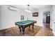 Bright game room features a pool table, creating a fun and inviting space for recreation and relaxation at 9542 Riviera Dr, Sherrills Ford, NC 28673