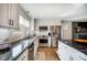 Modern kitchen featuring granite countertops, stainless steel appliances, and ample cabinet space at 9542 Riviera Dr, Sherrills Ford, NC 28673