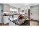 Modern kitchen featuring granite countertops, stainless steel appliances, and a functional center island at 9542 Riviera Dr, Sherrills Ford, NC 28673