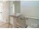 Small bathroom with pedestal sink and toilet at 119 Nat Barber Ave, Gastonia, NC 28052