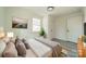 Light and airy bedroom with wood flooring and large window at 119 Nat Barber Ave, Gastonia, NC 28052