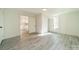 Bright bedroom with hardwood floors and access to the kitchen at 119 Nat Barber Ave, Gastonia, NC 28052