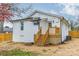 Rear view of a charming white house with wooden deck at 119 Nat Barber Ave, Gastonia, NC 28052