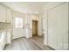 Bright kitchen with white cabinets, stainless steel appliances, and vinyl flooring at 119 Nat Barber Ave, Gastonia, NC 28052