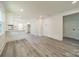 Modern white kitchen with new appliances and hardwood floors at 119 Nat Barber Ave, Gastonia, NC 28052