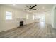 Spacious living room featuring hardwood floors and a fireplace at 119 Nat Barber Ave, Gastonia, NC 28052