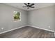 Bright bedroom with ceiling fan and a window at 201 School St, High Shoals, NC 28077