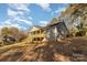 View of house exterior, showcasing a side porch and stairs at 201 School St, High Shoals, NC 28077