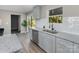 Modern kitchen with gray cabinets, granite countertops, and stainless steel appliances at 201 School St, High Shoals, NC 28012