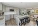 Modern kitchen with gray cabinets, granite countertops, and a large island at 201 School St, High Shoals, NC 28077