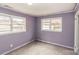 Bedroom with two large windows and purple walls at 2209 Dale Ave, Lincolnton, NC 28092