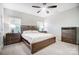 Cozy bedroom with neutral tones, comfortable bed, ceiling fan, and natural light at 25622 Seagull Dr # 645, Lancaster, SC 29720
