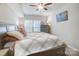 Cozy bedroom with a large bed, soft pillows, neutral decor, and natural light from a large window at 25622 Seagull Dr # 645, Lancaster, SC 29720