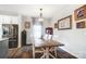 A dining room with an eating area with wood table and chairs near kitchen with stainless fridge at 25622 Seagull Dr # 645, Lancaster, SC 29720