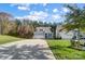 Well-maintained home with a long driveway, showcasing manicured lawn and landscaping at 25622 Seagull Dr # 645, Lancaster, SC 29720