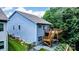 Exterior of the home with a large wooden deck with stairs and a lush green yard at 25622 Seagull Dr # 645, Lancaster, SC 29720