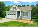 Charming home with blue siding, a two-car garage, and well-maintained landscaping at 25622 Seagull Dr # 645, Lancaster, SC 29720
