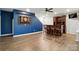 Game room with hardwood floors and a dart board on a blue accent wall next to the bar at 25622 Seagull Dr # 645, Lancaster, SC 29720