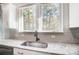 Bright kitchen sink with stainless steel faucet, granite countertop, and natural light at 25622 Seagull Dr # 645, Lancaster, SC 29720