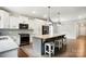 Modern kitchen with large island, stainless appliances, and adjacent dining area at 25622 Seagull Dr # 645, Lancaster, SC 29720