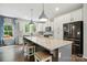 Well-equipped kitchen features an island with stools, stainless appliances, and ample cabinetry at 25622 Seagull Dr # 645, Lancaster, SC 29720