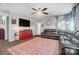 Spacious living room featuring a large sectional sofa, a ceiling fan, and bright natural light at 25622 Seagull Dr # 645, Lancaster, SC 29720