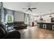 Spacious living room featuring hardwood floors, and a kitchen area with modern cabinetry and a stylish breakfast bar at 25622 Seagull Dr # 645, Lancaster, SC 29720