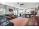 Open-concept living room with comfortable leather sofa, hardwood floors, and an open kitchen space at 25622 Seagull Dr # 645, Lancaster, SC 29720