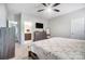 Spacious main bedroom featuring neutral tones, carpet, ceiling fan, and an ensuite bathroom at 25622 Seagull Dr # 645, Lancaster, SC 29720