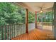 Relaxing screened porch with wooden flooring, a ceiling fan, and a view of the surrounding trees and outdoor scenery at 25622 Seagull Dr # 645, Lancaster, SC 29720