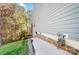 View of the home's side yard with a concrete path and lush green landscaping at 25622 Seagull Dr # 645, Lancaster, SC 29720